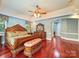Elegant main bedroom with hardwood floors and a sitting area at 9100 Woodhall Lake Dr, Waxhaw, NC 28173