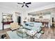 Living area with open concept kitchen, light teal sofa and hardwood floors at 2031 Masons Bend Dr, Fort Mill, SC 29708