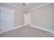 Bedroom with carpet, double doors, and hallway at 3921 Sky Dr, Charlotte, NC 28226