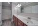Bathroom with double vanity, tub, and updated fixtures at 3921 Sky Dr, Charlotte, NC 28226