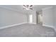 Bright bedroom featuring neutral walls and carpet at 3921 Sky Dr, Charlotte, NC 28226
