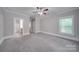 Bright bedroom with carpeting, ceiling fan and en-suite bathroom at 3921 Sky Dr, Charlotte, NC 28226