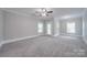 Spacious bedroom with ceiling fan and access to balcony at 3921 Sky Dr, Charlotte, NC 28226