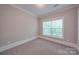 Spacious bedroom with neutral walls and carpet at 3921 Sky Dr, Charlotte, NC 28226