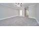 Bright bedroom featuring neutral walls and carpet at 3921 Sky Dr, Charlotte, NC 28226