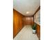 Sunroom with wood paneling, tile floor, and large windows at 502 Hyde St, Kannapolis, NC 28083