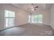 Spacious bedroom with carpet flooring and multiple windows at 6232 Hickory Cove Ln, Charlotte, NC 28269