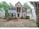 Brick two-story home with a traditional facade and landscaping at 6232 Hickory Cove Ln, Charlotte, NC 28269