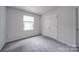 Charming bedroom with grey carpet and double closet at 6232 Hickory Cove Ln, Charlotte, NC 28269