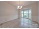 Bright dining room with tile floors and a bay window at 6232 Hickory Cove Ln, Charlotte, NC 28269