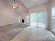 Spacious living room with fireplace and access to deck at 6232 Hickory Cove Ln, Charlotte, NC 28269