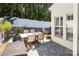 Relaxing patio features a brick design and outdoor dining set at 1804 Robinwood Village Dr, Gastonia, NC 28054
