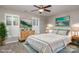 Virtually staged bedroom with wood dresser and ceiling fan at 1804 Robinwood Village Dr, Gastonia, NC 28054