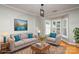 Virtually staged living room with bay window and comfortable seating at 1804 Robinwood Village Dr, Gastonia, NC 28054