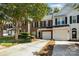 Townhouse with white exterior and two car garage at 1804 Robinwood Village Dr, Gastonia, NC 28054
