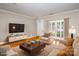 Virtually staged living room featuring hardwood floors and access to backyard at 1804 Robinwood Village Dr, Gastonia, NC 28054
