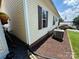 Home's exterior side view with AC unit at 231 Badin View Rd, New London, NC 28127