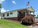 Single-story home with large wrap-around porch at 231 Badin View Rd, New London, NC 28127