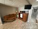 Finished basement recreation area with seating and kitchenette at 231 Badin View Rd, New London, NC 28127