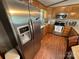 Stainless steel appliances and granite countertops highlight this kitchen at 231 Badin View Rd, New London, NC 28127