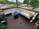 Relaxing deck with sectional sofa and fire pit at 231 Badin View Rd, New London, NC 28127