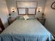 Bright bedroom featuring a king-size bed and two nightstands at 231 Badin View Rd, New London, NC 28127