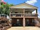 Two-story home with large deck and brick accents at 231 Badin View Rd, New London, NC 28127