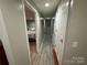 Basement hallway with doors to bedrooms and other areas at 231 Badin View Rd, New London, NC 28127