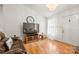 Living room with hardwood floors, recliner, and large TV at 1000 Hawkinstown Rd, Salisbury, NC 28144