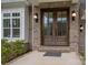 Inviting front entry with double doors and brick facade at 811 Naples Dr, Davidson, NC 28036