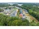 Aerial view of house and neighborhood near lake at 811 Naples Dr, Davidson, NC 28036