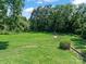 Expansive backyard with lush lawn and mature trees at 510 5Th St, Spencer, NC 28159