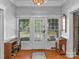 Inviting entryway with hardwood floors, coat closet and decorative mirror at 510 5Th St, Spencer, NC 28159
