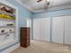 Bedroom with built-in shelves and hardwood floors at 510 5Th St, Spencer, NC 28159