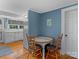 Charming kitchen with white cabinets and a small dining table at 510 5Th St, Spencer, NC 28159