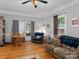 Bright living room with hardwood floors, a dining area and comfortable seating at 510 5Th St, Spencer, NC 28159