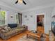 Spacious living room with hardwood floors, a couch and a view into another room at 510 5Th St, Spencer, NC 28159
