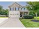Two story home with two car garage and landscaped yard at 127 Tranquil Ct # 18A, Locust, NC 28097
