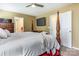 Main bedroom with a comfortable king-size bed and access to bathroom at 127 Tranquil Ct # 18A, Locust, NC 28097