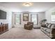 Versatile bonus room with plenty of natural light and carpeted flooring at 127 Tranquil Ct # 18A, Locust, NC 28097