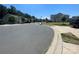Quiet residential street with houses and green lawns at 127 Tranquil Ct # 18A, Locust, NC 28097