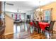 Spacious dining area with hardwood floors and red tablecloth at 127 Tranquil Ct # 18A, Locust, NC 28097