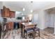Open kitchen with island, stainless steel appliances, and hardwood floors at 127 Tranquil Ct # 18A, Locust, NC 28097