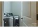 Convenient laundry room with full-size washer and dryer at 127 Tranquil Ct # 18A, Locust, NC 28097