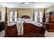 Large main bedroom with a post bed and ensuite bathroom at 127 Tranquil Ct # 18A, Locust, NC 28097