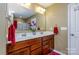 Bathroom with double vanity and a large mirror at 127 Tranquil Ct # 18A, Locust, NC 28097