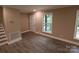 Bright living room with hardwood floors and neutral walls at 310 Chaney St, Wingate, NC 28174