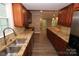 Renovated kitchen with granite counters and stainless steel appliances at 310 Chaney St, Wingate, NC 28174