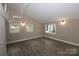 Bright living room featuring hardwood floors and multiple windows at 310 Chaney St, Wingate, NC 28174