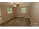 Bright bedroom with wood-look floors and neutral walls at 310 Chaney St, Wingate, NC 28174